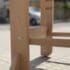 a wooden chair leg on a brick surface